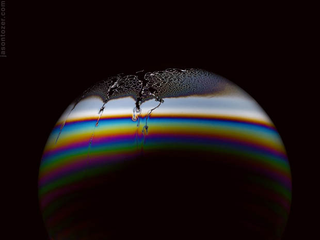 Illustration for article titled Photos of Soap Bubbles that Look Like Trippy Exoplanets